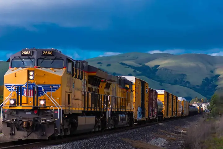 A freight train carrying vehicle transport rail cars